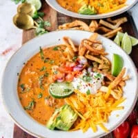 close up of a full bowl of chicken taco soup loaded with toppings and ready to eat