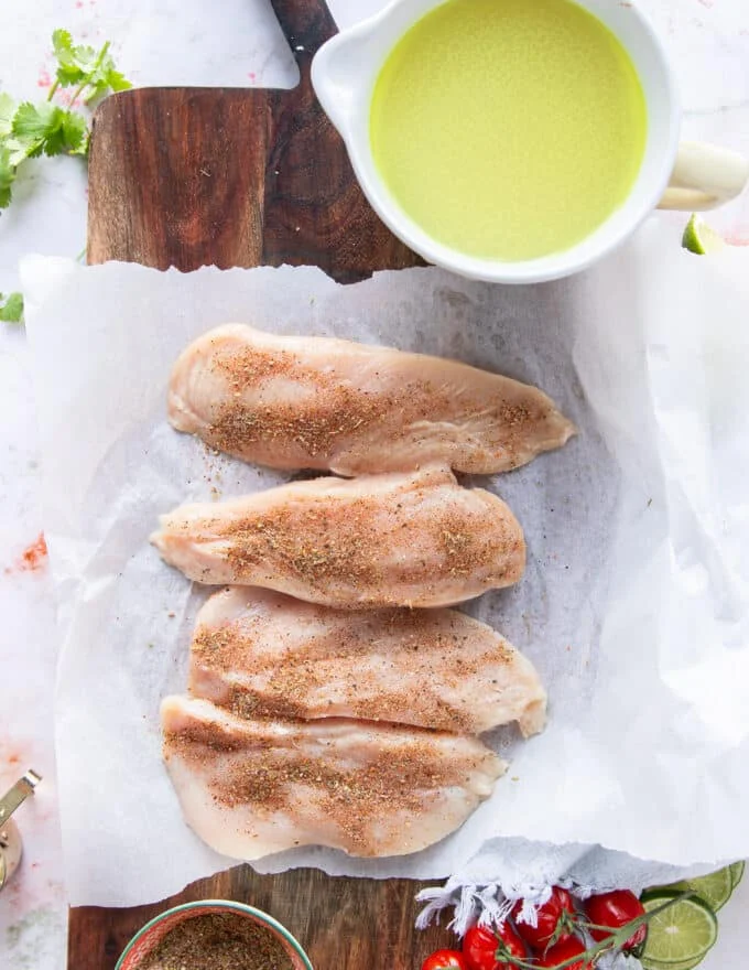 the chicken breasts are cut in half and seasoned to start the chicken taco soup from scratch