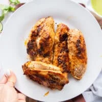 The seared chicken removed on to a separate plate