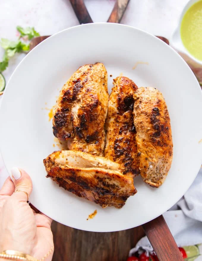 The seared chicken removed on to a separate plate