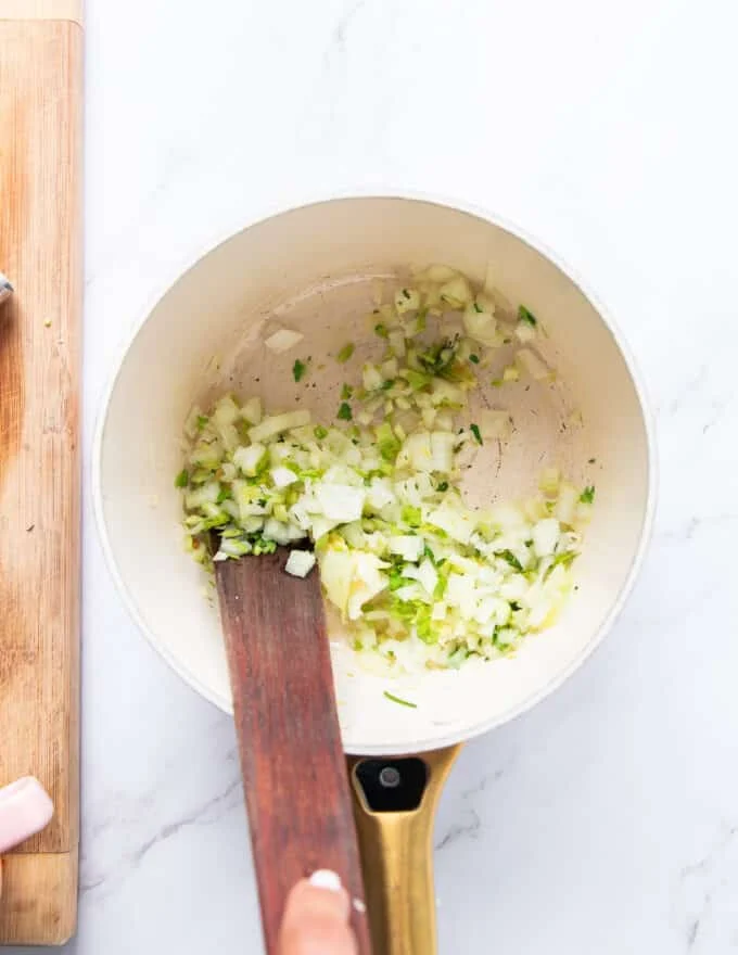Starting with the base for crab bisque with butter, onion and celery