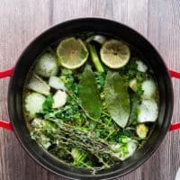 Aromatics added to a large pot with water