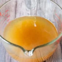 freshly strained crab stock still in the bowl
