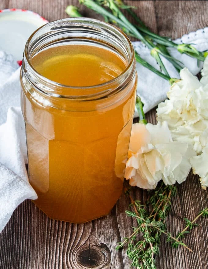 Perfectly cooled crab stock in a mason jar ready to store