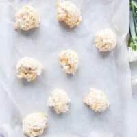 drop biscuits dropped on a baking sheet lined with parchment paper ready to go into the oven
