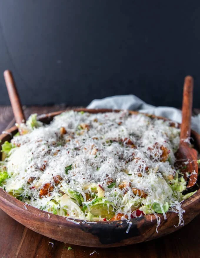 close up side view of a large bowl of brussel sprout salad