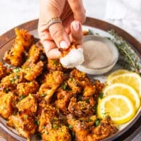 Buffalo cauliflower crispy and dipped and in ranch sauce