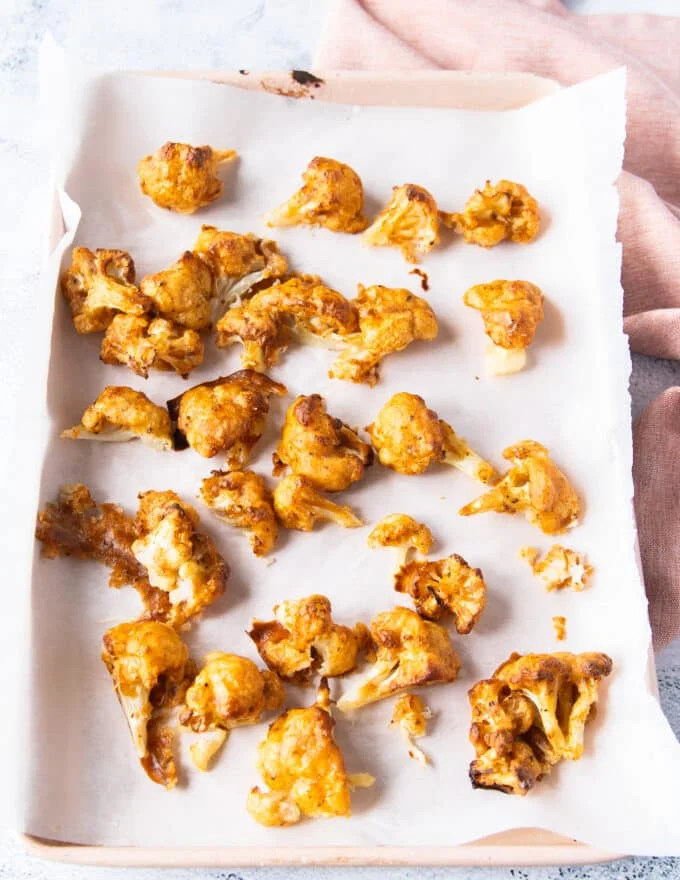 Cauliflower baked and out of the oven ready for the second coating.