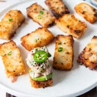 Copycat nobu spicy tuna crispy rice garnished with jalapenos and sesame seeds