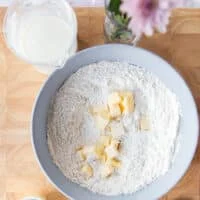 Cold butter pieces added to the flour mixture bowl