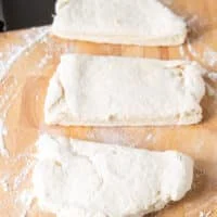 The biscuit dough cut into three pieces
