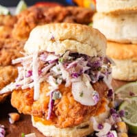 Chicken Biscuit layered with corn slaw and spicy chicken and biscuits