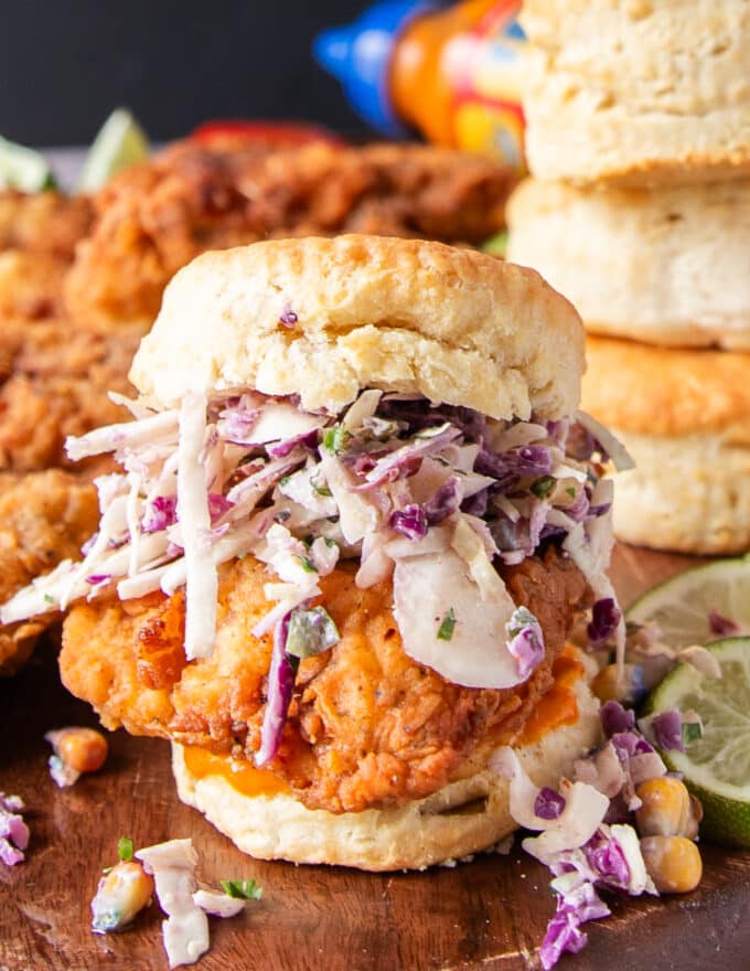 Chicken Biscuit layered with corn slaw and spicy chicken and biscuits