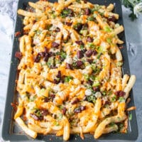 the toppings are added over the melted cheese