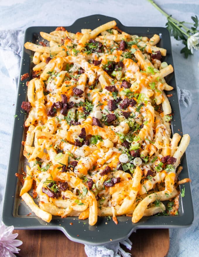 the toppings are added over the melted cheese