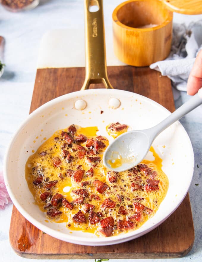 crispy and perfectly cooked crumbles of sausage or bacon in a skillet