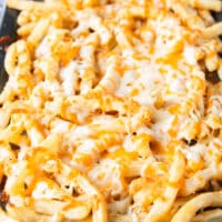 melted cheese over the fries out of the oven ready to be loaded