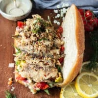 Sardines are added over the the veggies and salad ingredients