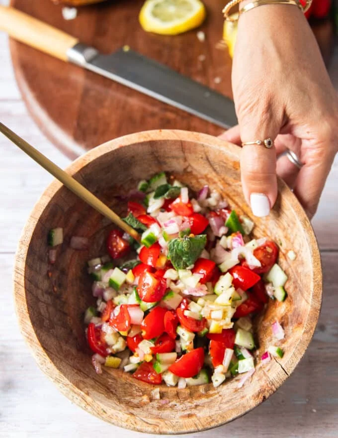 The topping ingredients all mixed together in a bowl and ready to use on the sandwich
