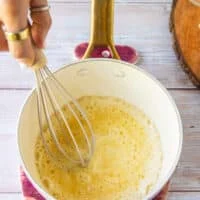 Cooked flour and butter in a sauce pan to make the roux base for the queso dip