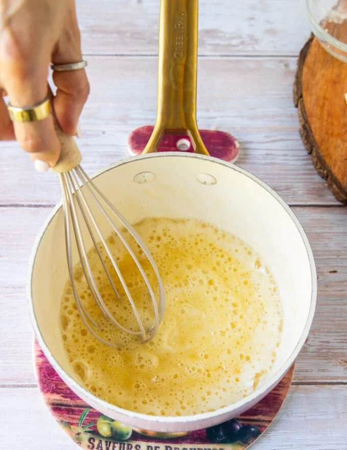 Cooked flour and butter in a sauce pan to make the roux base for the queso dip