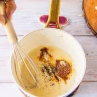 Add the spices to the pan to infuse the base
