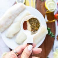 The seasoning blend for air fryer cod in a small bowl being mixed together