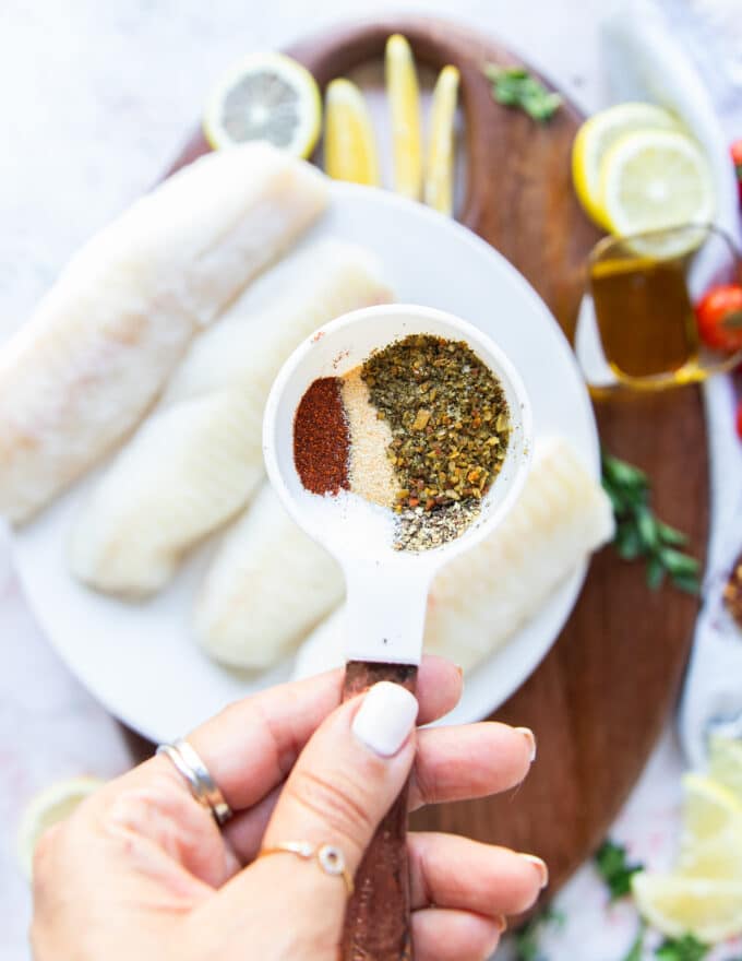 The seasoning blend for air fryer cod in a small bowl being mixed together