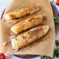 cod fillets seasoned on both sides with olive oil and the dry seasoning blend ready to air fry