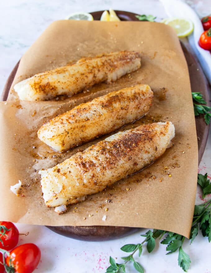 cod fillets seasoned on both sides with olive oil and the dry seasoning blend ready to air fry