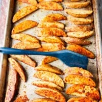 potato wedges flipped halfway to continue crisping the other side