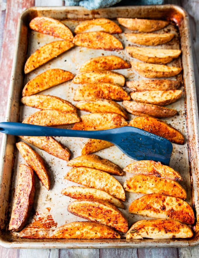potato wedges flipped halfway to continue crisping the other side