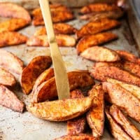 flipped potato wedges on both sides showing the ultimate crips texture on the outside and golden color with fluffy inside