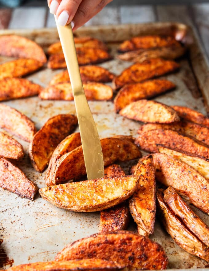 flipped potato wedges on both sides showing the ultimate crips texture on the outside and golden color with fluffy inside