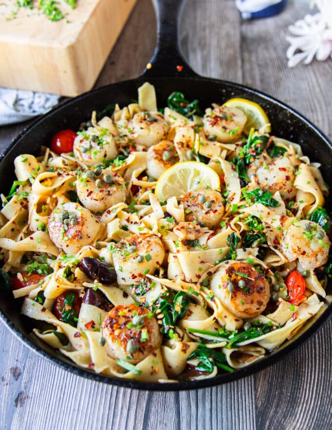 the scallops are nestled right over the pasta and sauce
